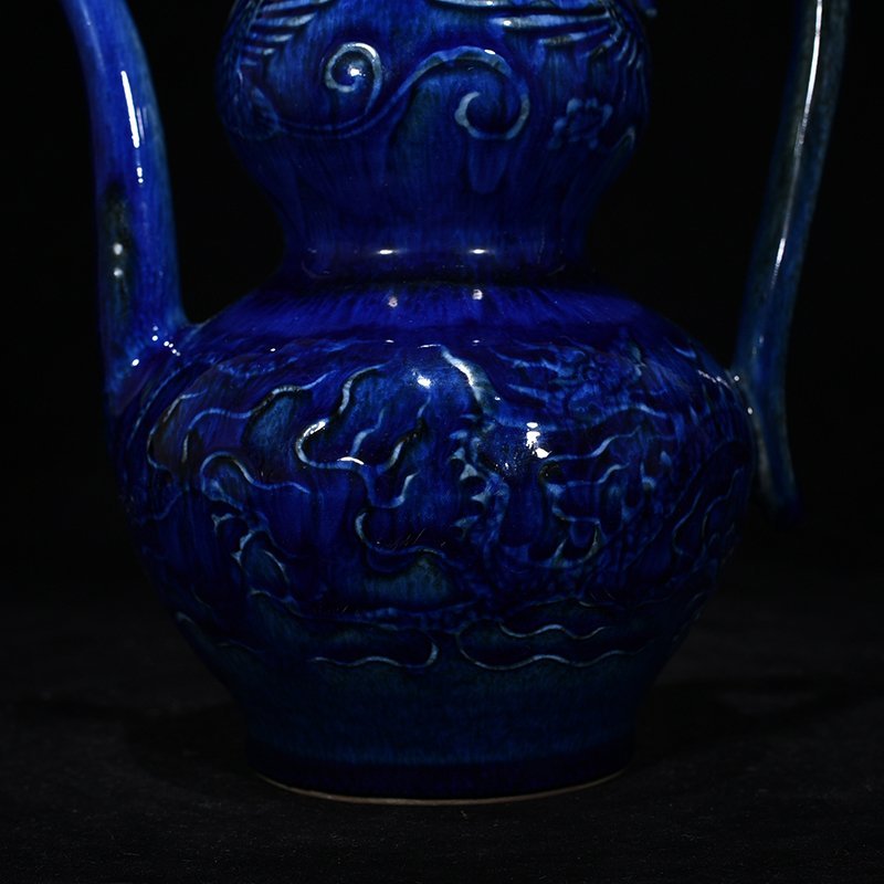 Yuan Dynasty blue glaze carved with dragon and phoenix patterns gourd holding pot