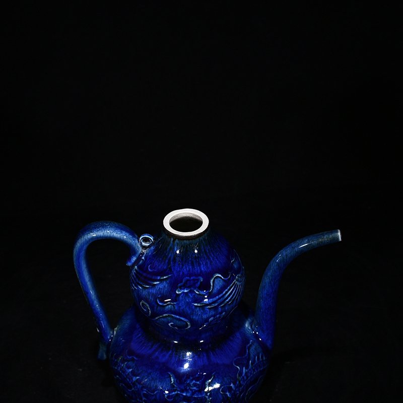 Yuan Dynasty blue glaze carved with dragon and phoenix patterns gourd holding pot