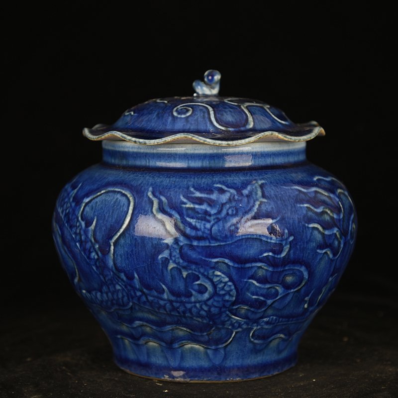 Yuan Dynasty blue glaze carved dragon pattern lotus leaf jar