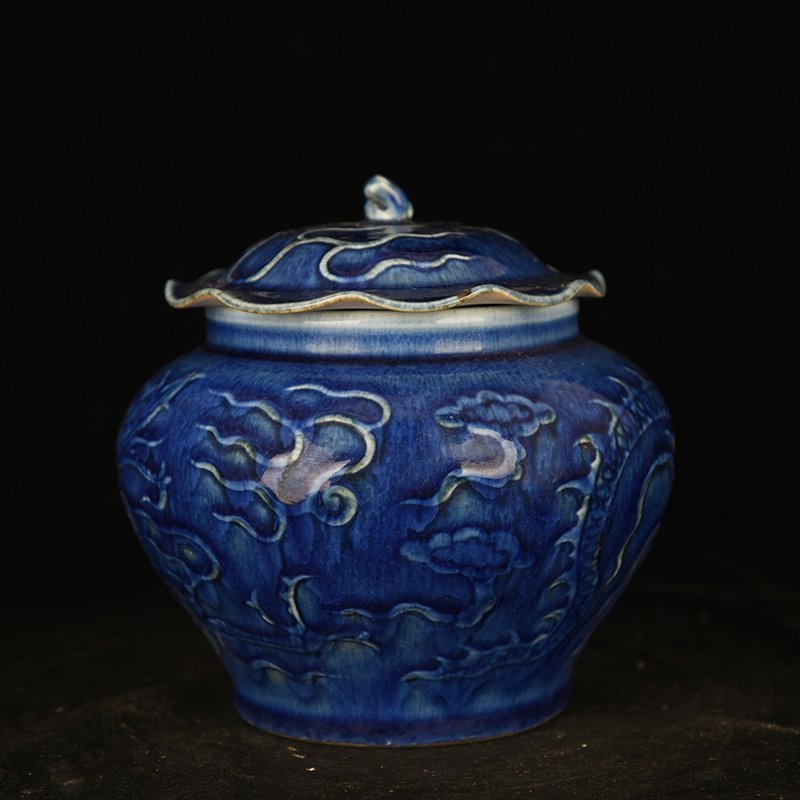 Yuan Dynasty blue glaze carved dragon pattern lotus leaf jar