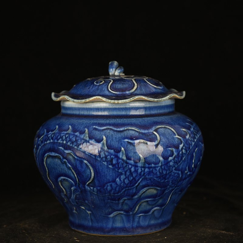 Yuan Dynasty blue glaze carved dragon pattern lotus leaf jar