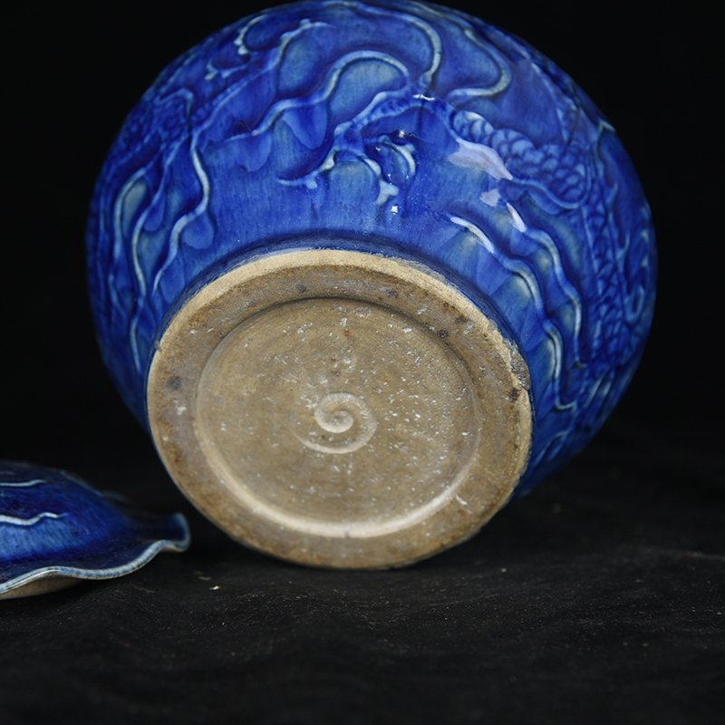 Yuan Dynasty blue glaze carved dragon pattern lotus leaf jar