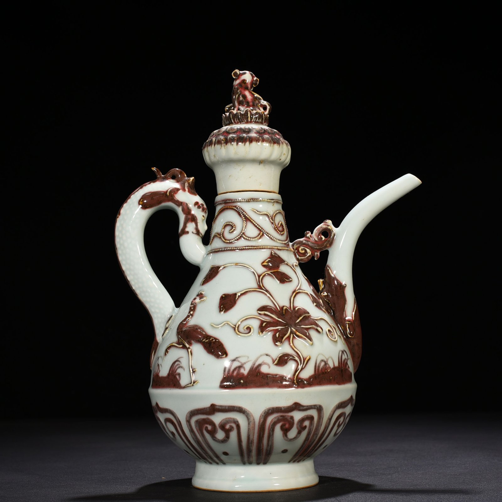 Yuan Dynasty underglaze red embossed lion rolling hydrangea and holding a pot