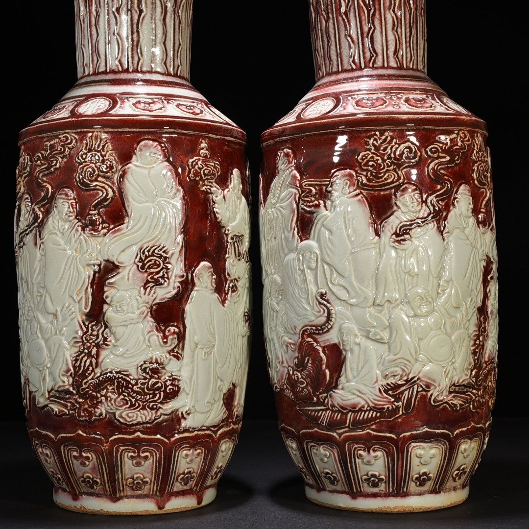 Yuan Dynasty underglaze red and white carved mallet vase with eighteen arhat figures