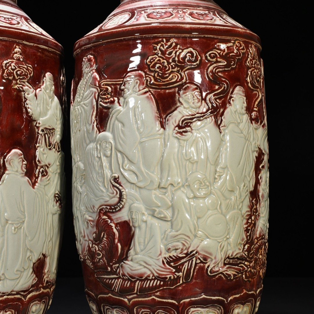 Yuan Dynasty underglaze red and white carved mallet vase with eighteen arhat figures