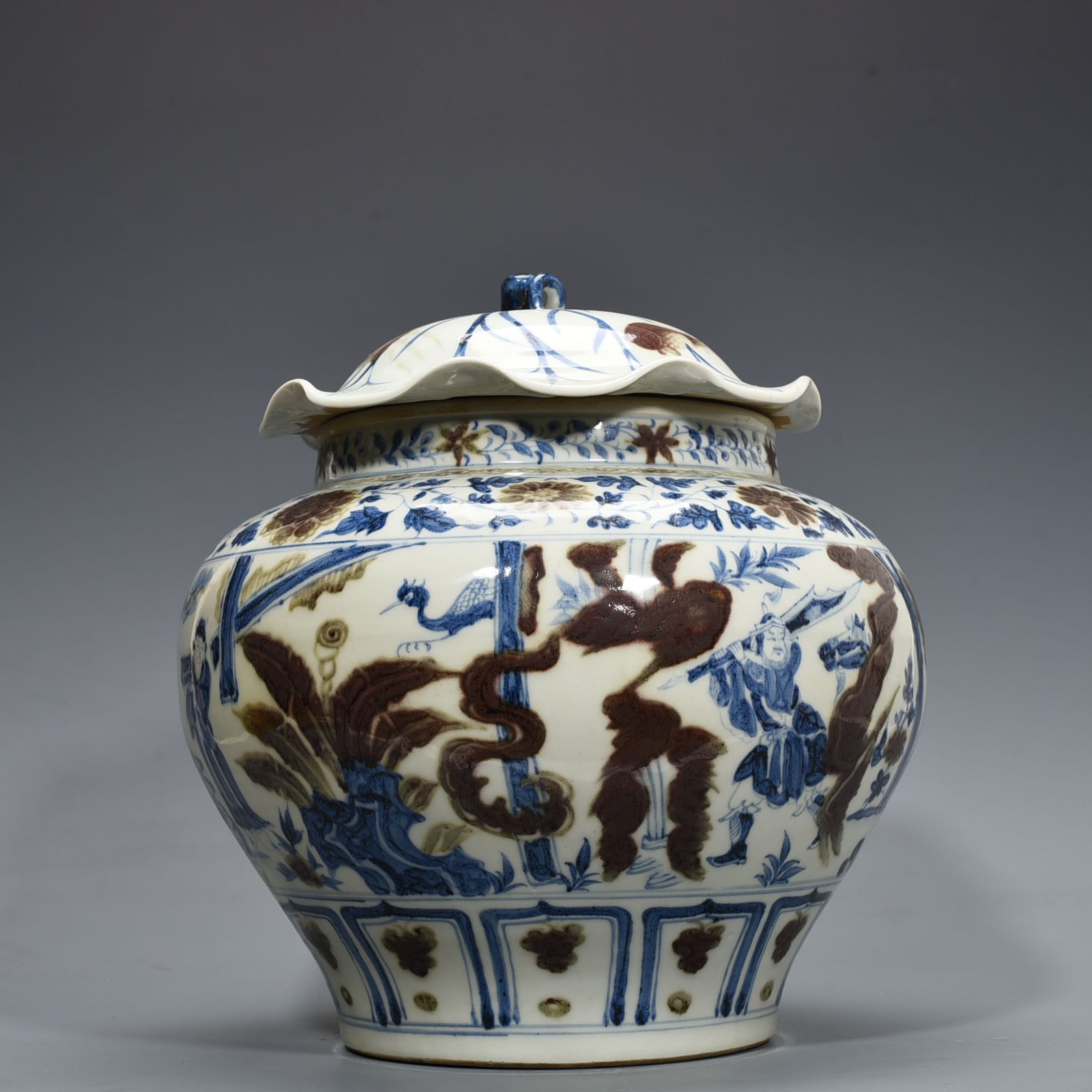 Yuan Dynansty blue and white underglaze red three-story thatched cottage lotus leaf covered jar