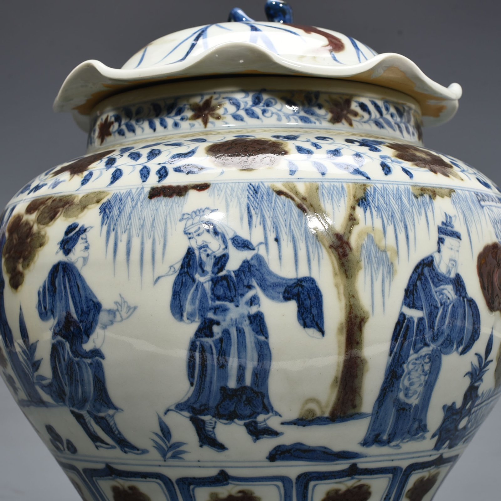 Yuan Dynansty blue and white underglaze red three-story thatched cottage lotus leaf covered jar
