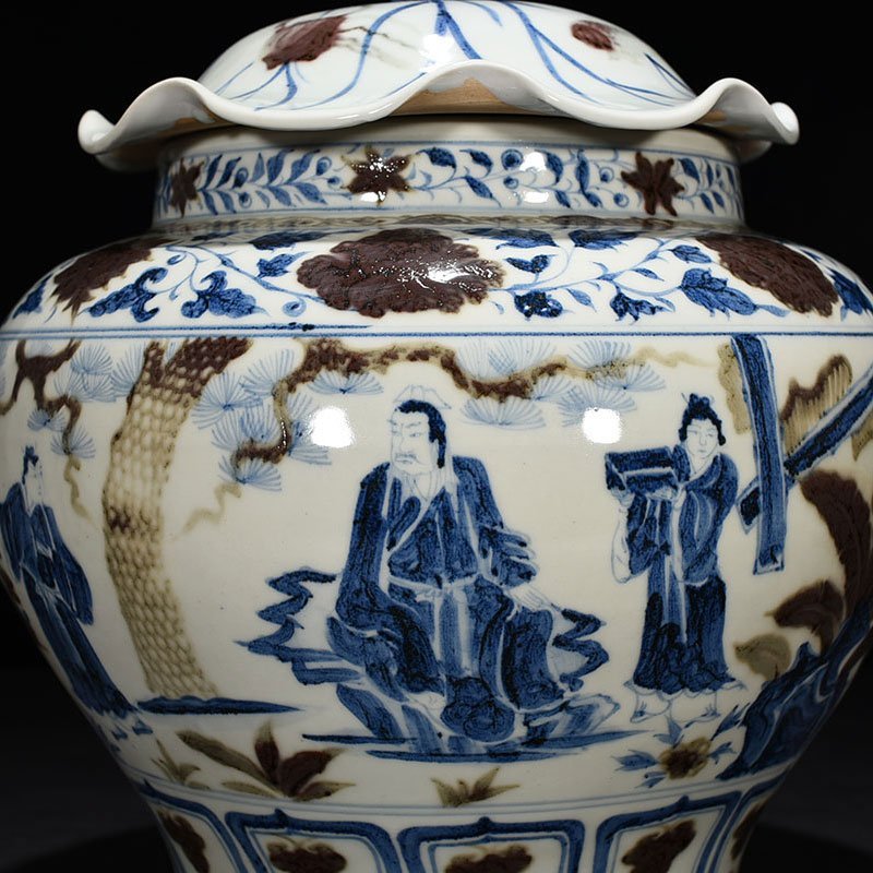 Yuan Dynasty blue and white underglaze red lotus leaf jar with three-story thatched cottage character pattern