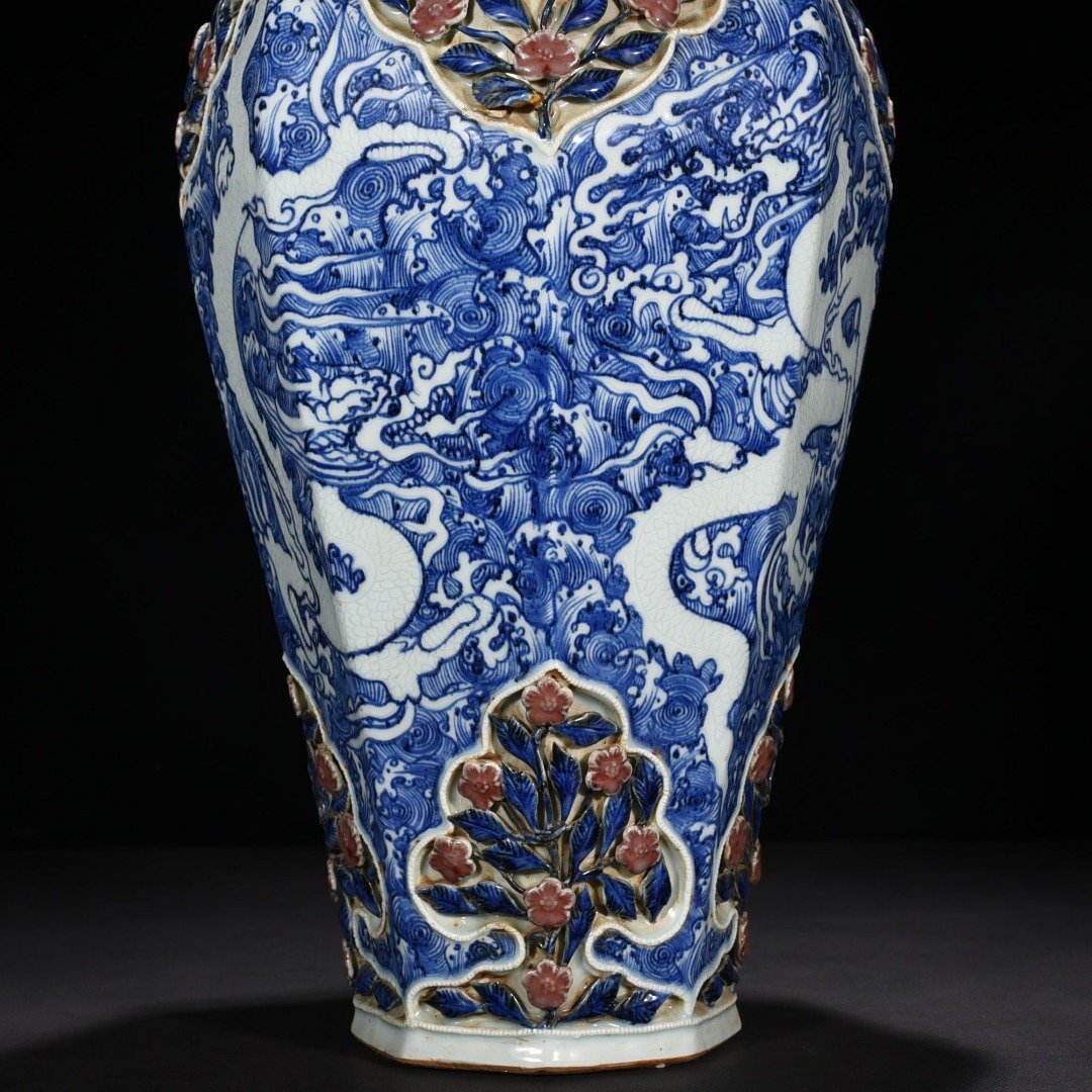 Yuan Dynasty blue and white underglaze red plastic four-season flower engraved with sea water and dragon pattern octagonal plum vase