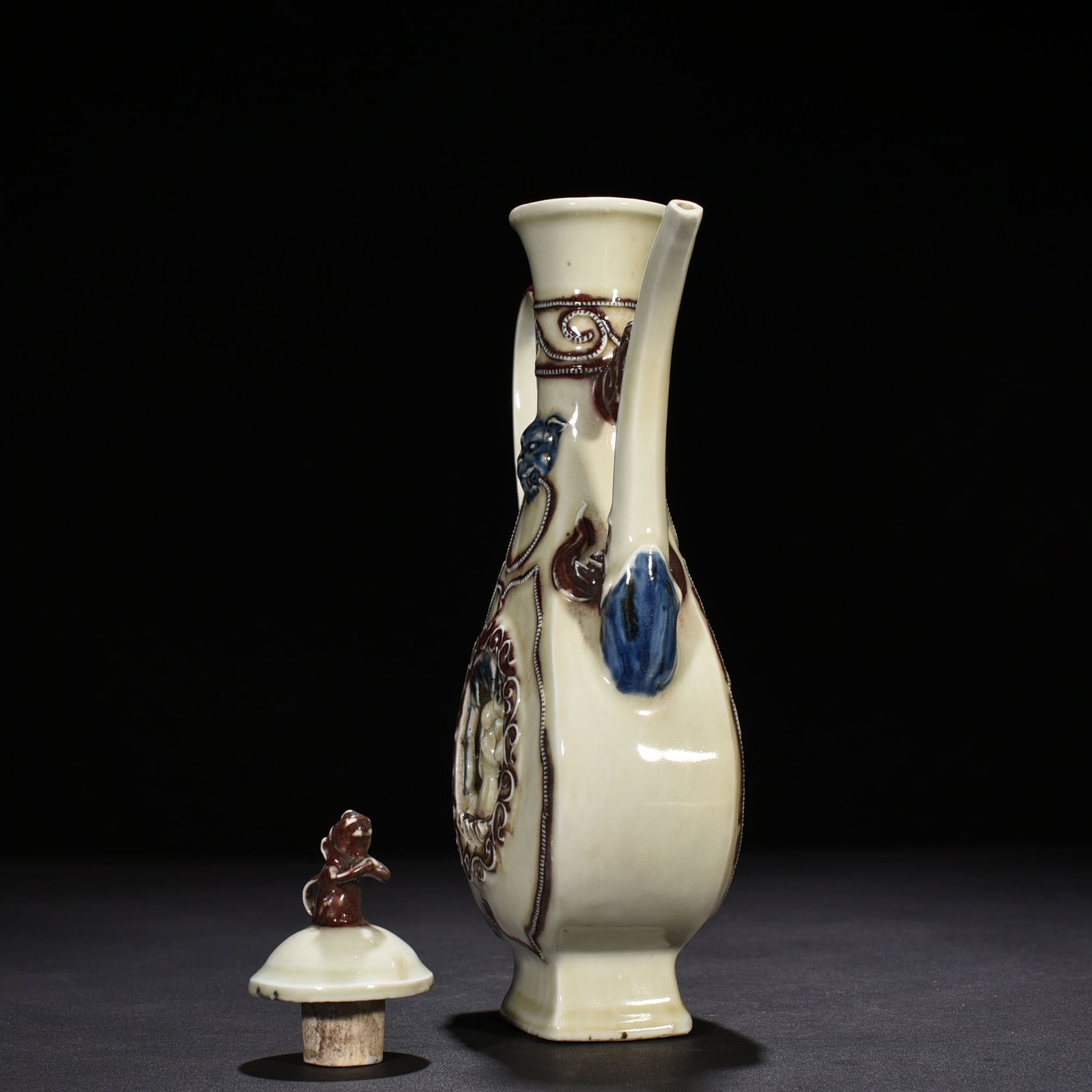 Yuan Dynasty blue and white underglaze red hollow figure-shaped square-handled teapot