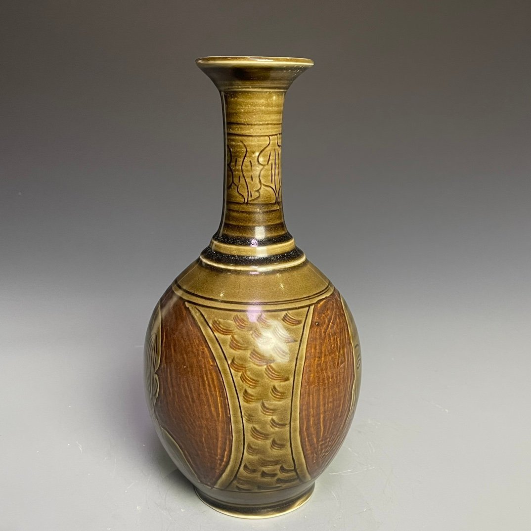 Song Dynasty Ding kiln carved figure-shaped long-neck bottle