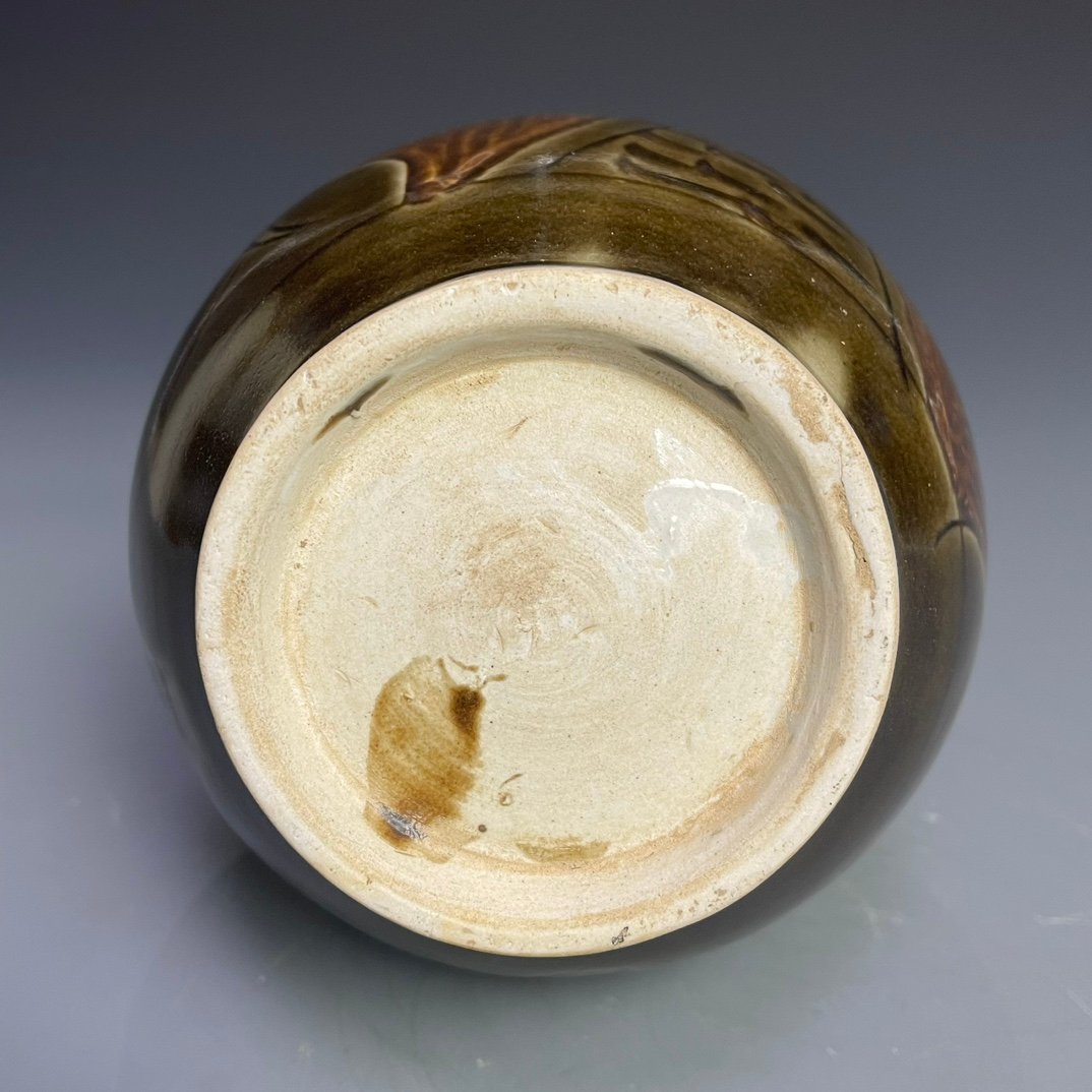 Song Dynasty Ding kiln carved figure-shaped long-neck bottle