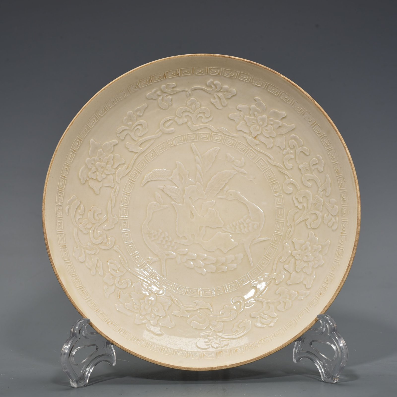 Song Dynasty Ding kiln carved peacock and peony pattern plate