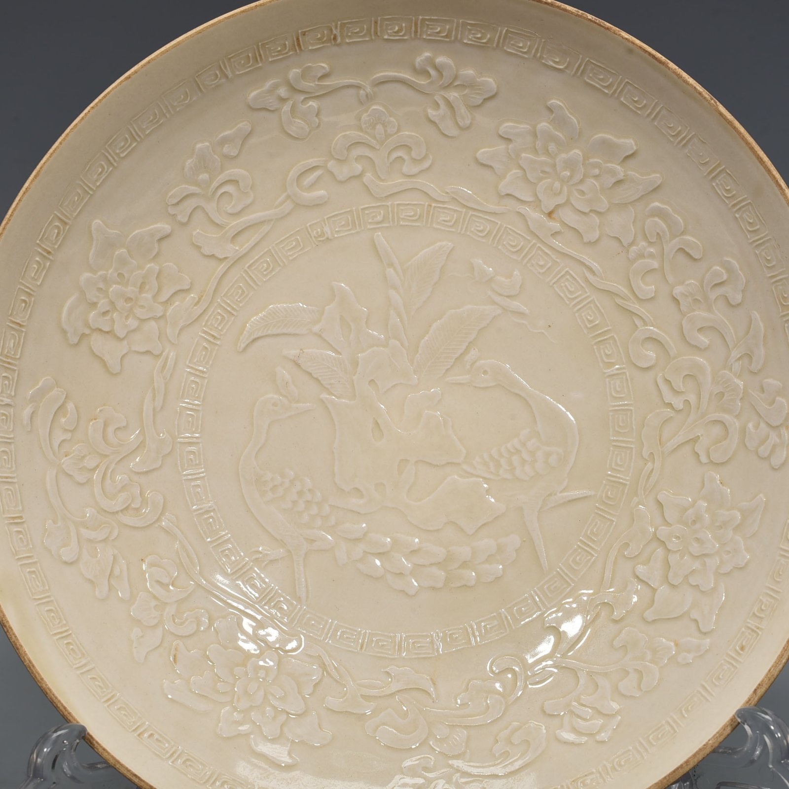 Song Dynasty Ding kiln carved peacock and peony pattern plate