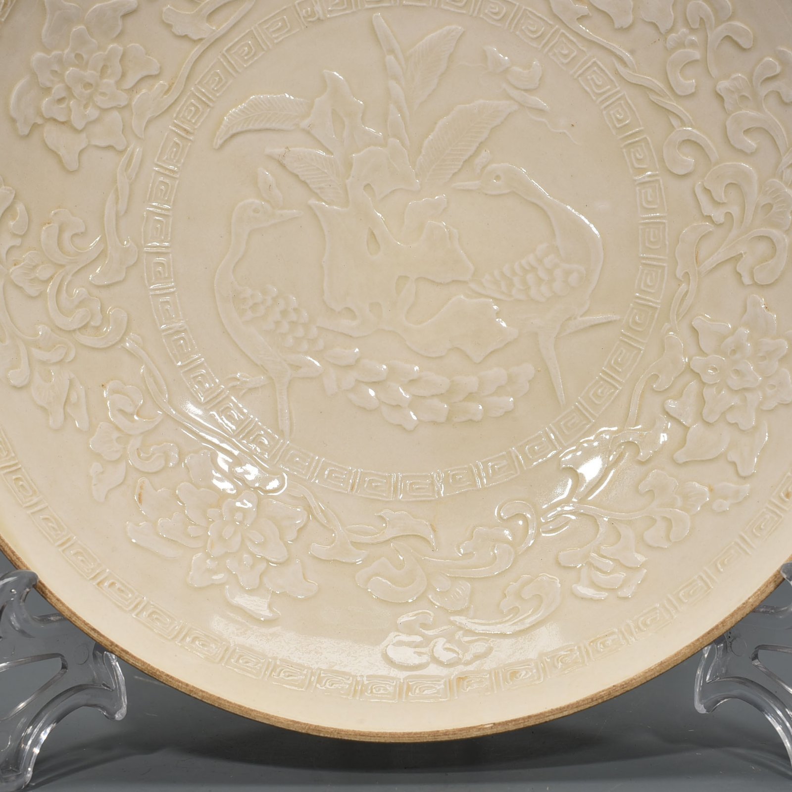 Song Dynasty Ding kiln carved peacock and peony pattern plate