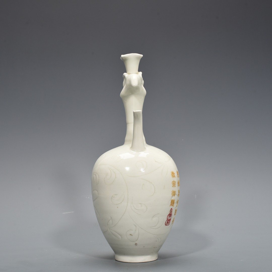 Song Dynasty Ding kiln engraved imperial inscription phoenix head pot