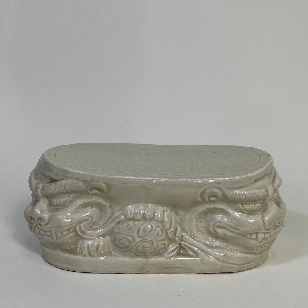 Song Dynasty Ding kiln carved flower lion pillow
