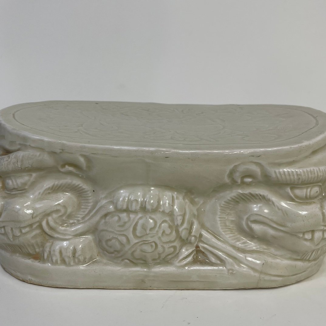 Song Dynasty Ding kiln carved flower lion pillow
