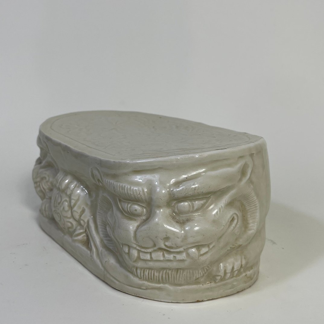 Song Dynasty Ding kiln carved flower lion pillow
