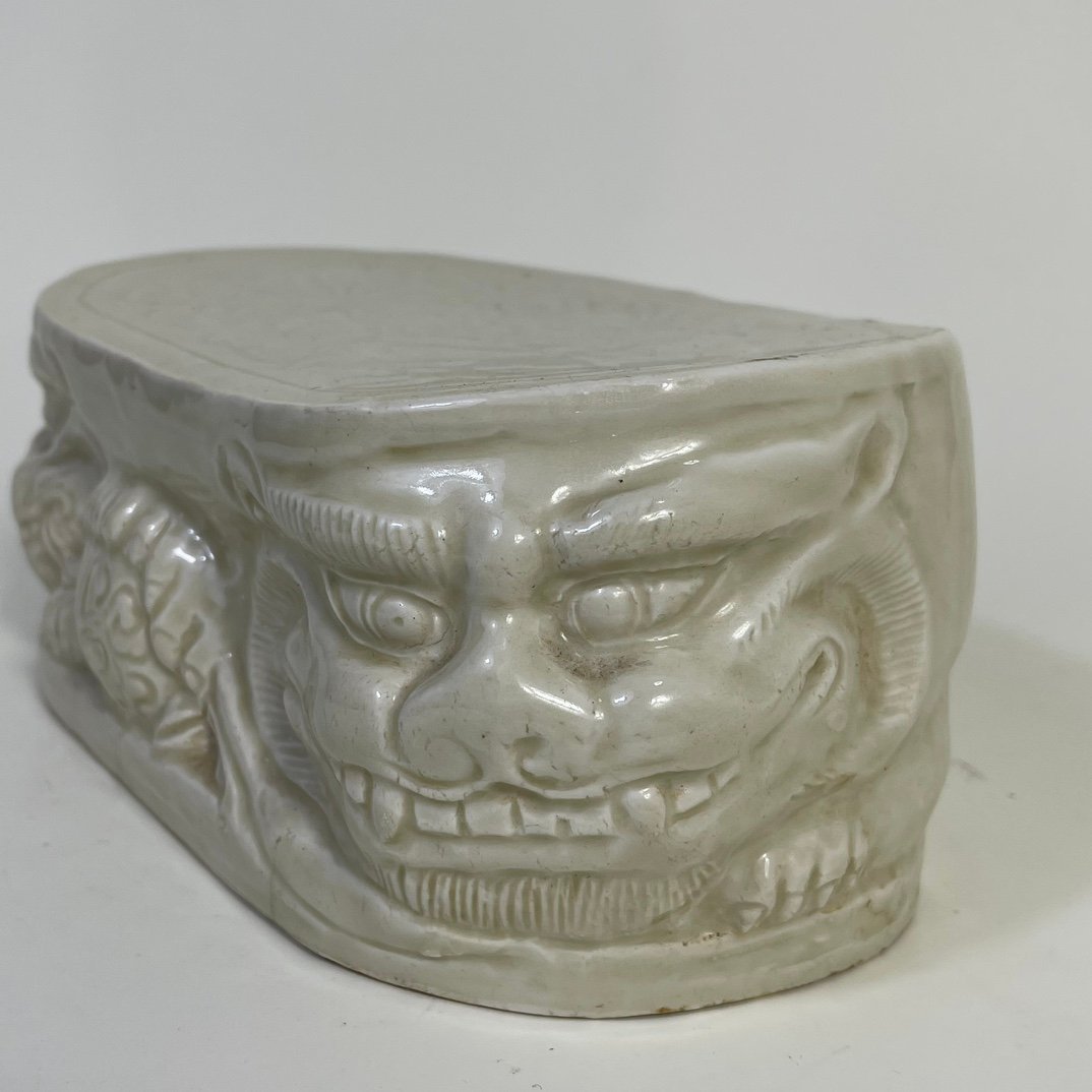 Song Dynasty Ding kiln carved flower lion pillow