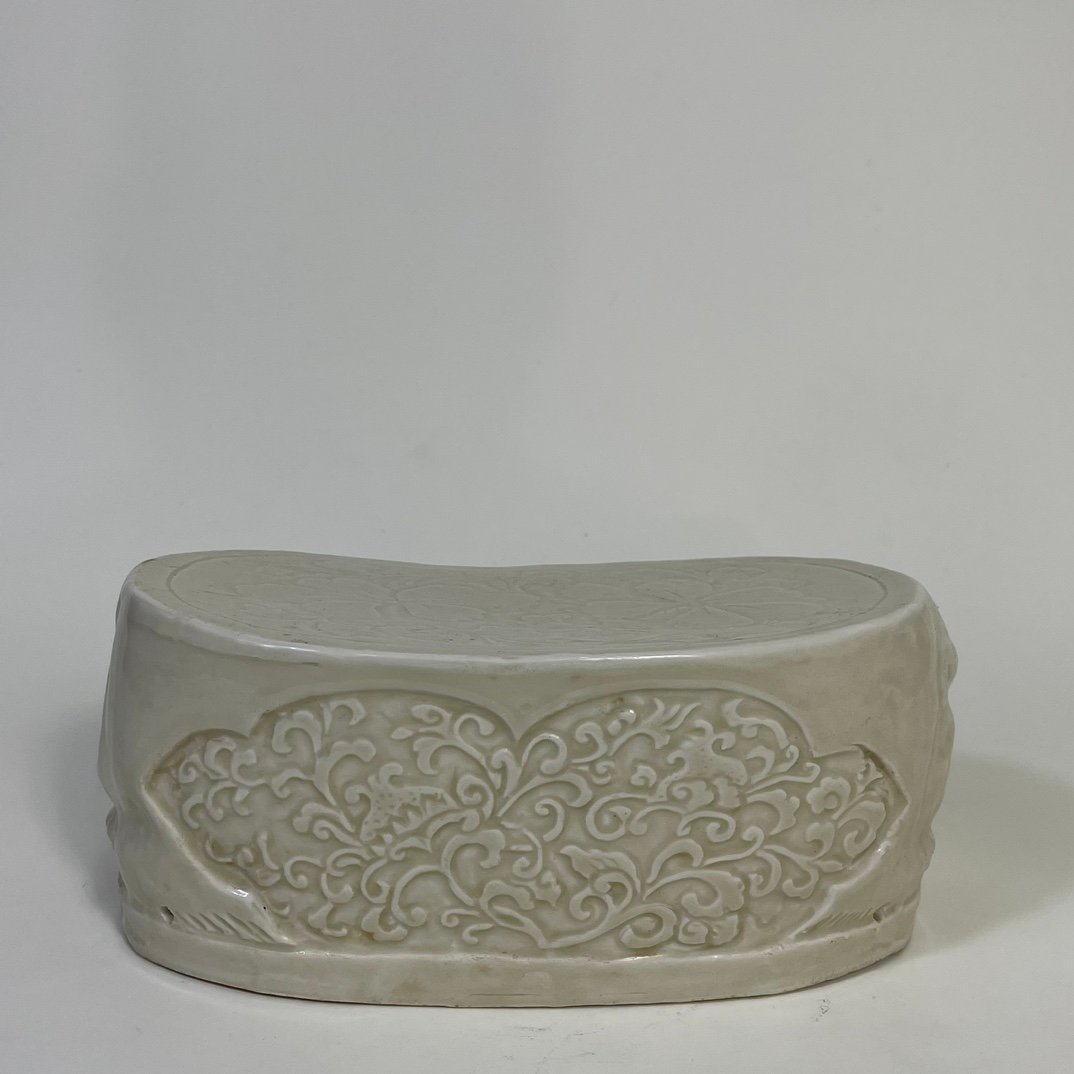 Song Dynasty Ding kiln carved flower lion pillow