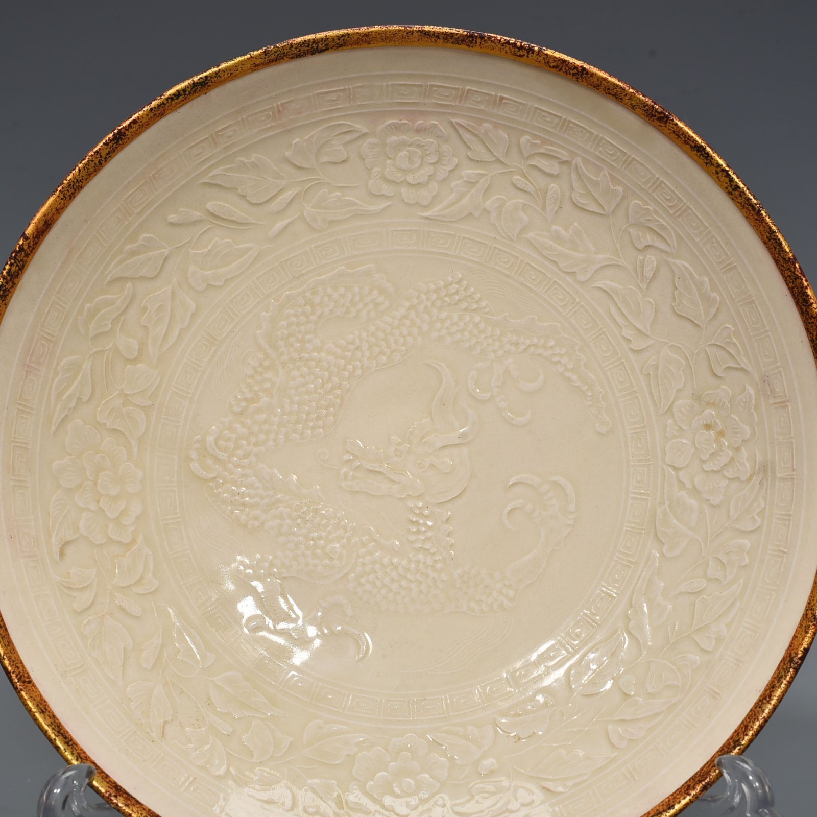 Song Dynasty Ding kiln carved flower and dragon pattern plate