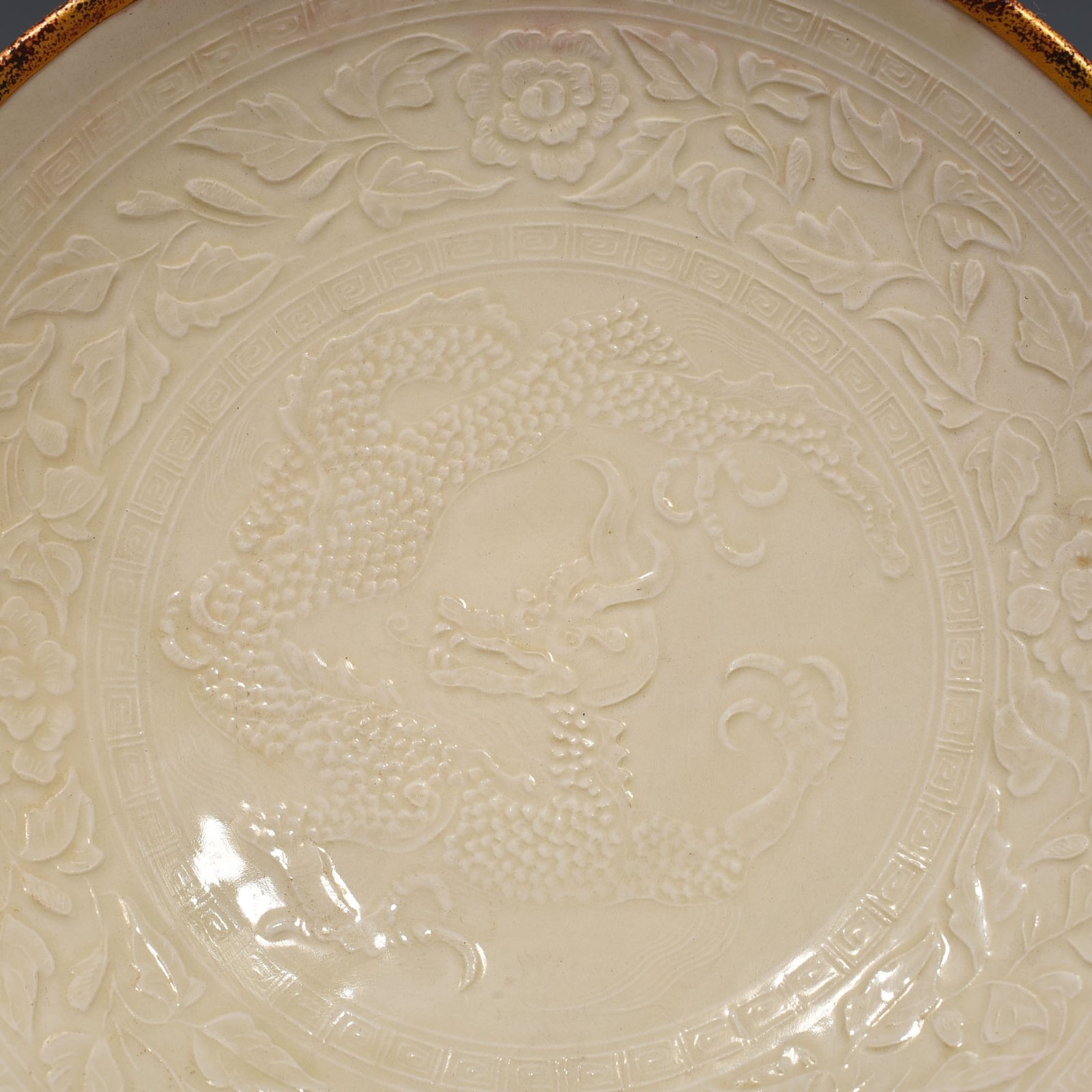 Song Dynasty Ding kiln carved flower and dragon pattern plate