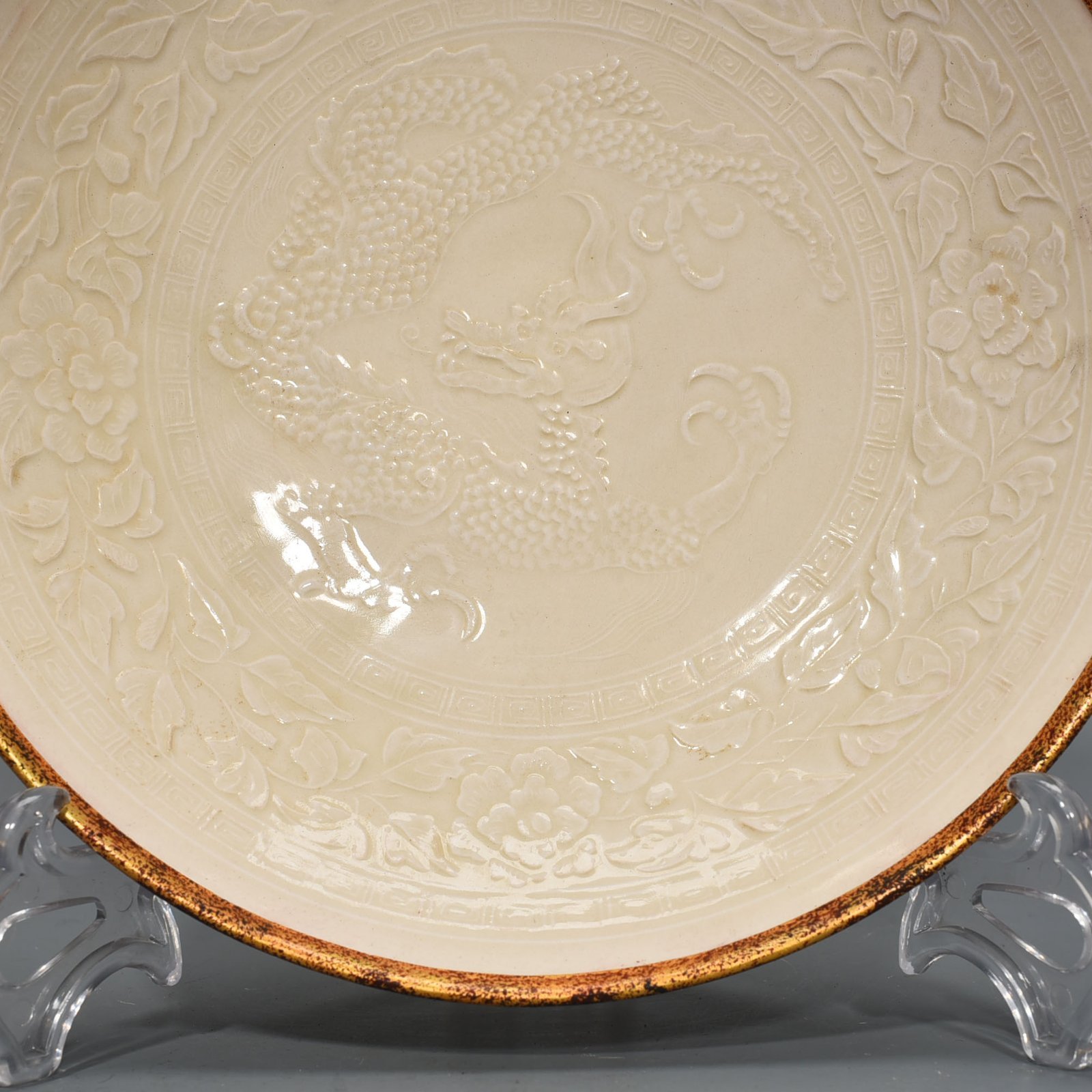 Song Dynasty Ding kiln carved flower and dragon pattern plate