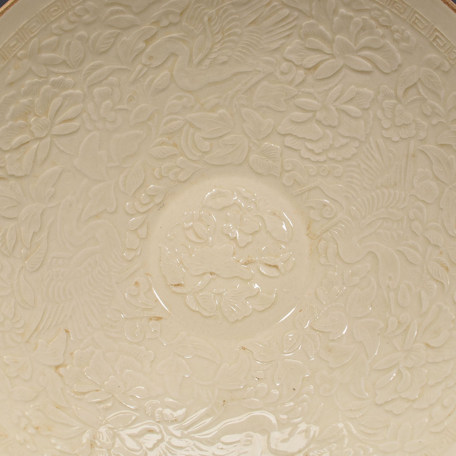 Song Dynasty Ding Kiln carved flower and bird pattern bowl