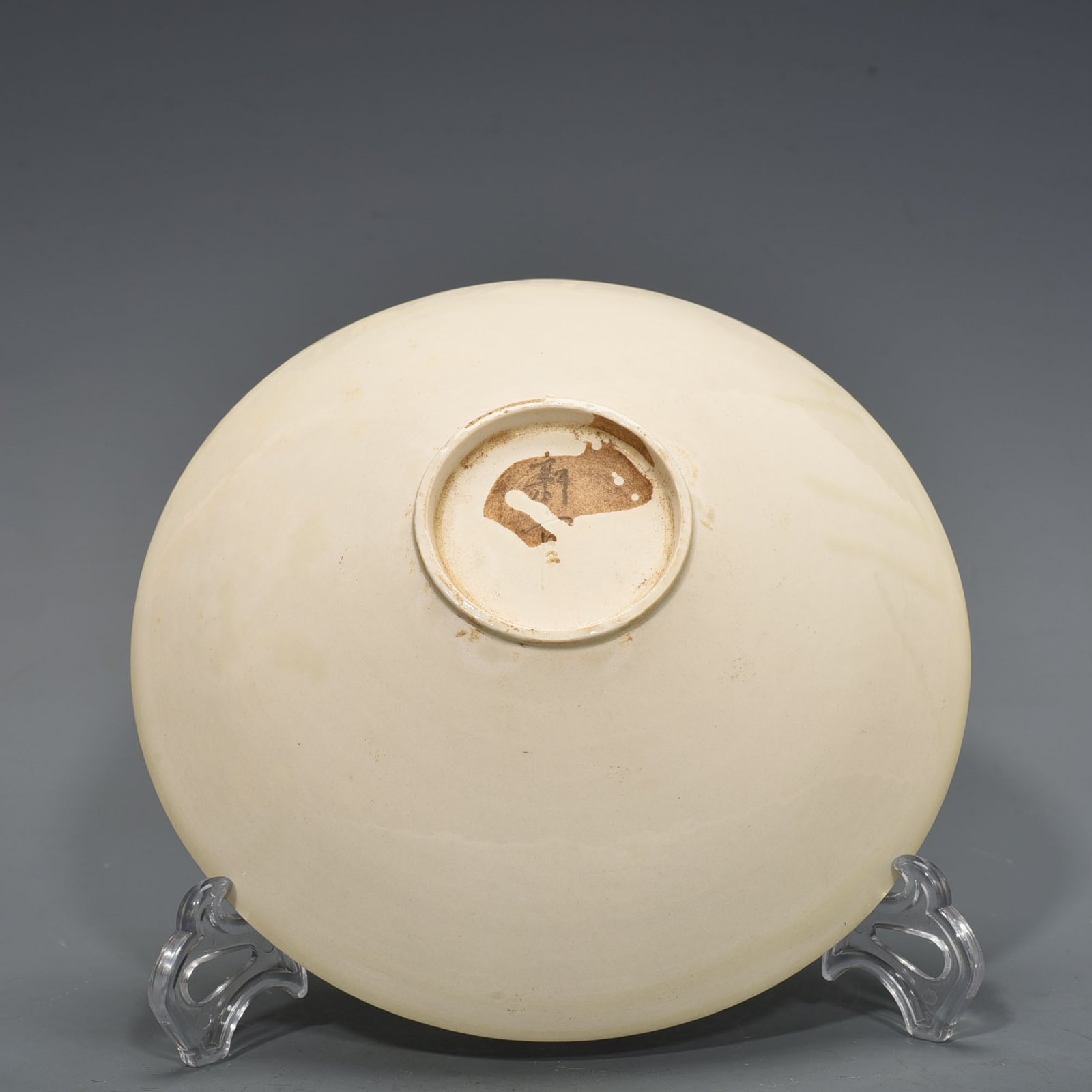 Song Dynasty Ding Kiln carved flower and bird pattern bowl