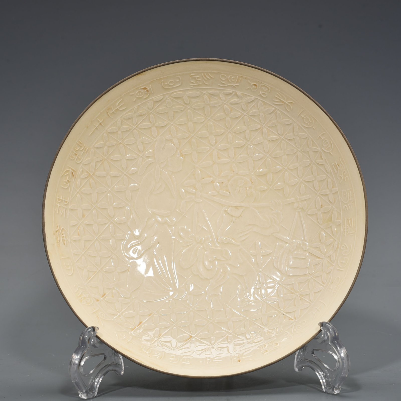 Song Dynasty Ding kiln carved plate with figures of Taoist figures
