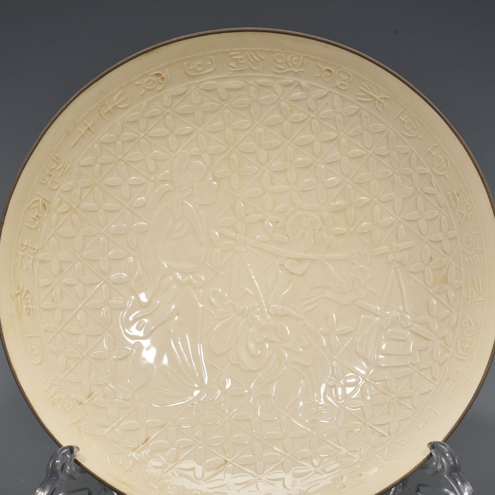 Song Dynasty Ding kiln carved plate with figures of Taoist figures