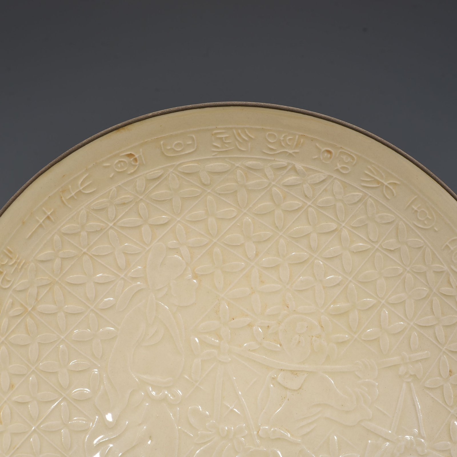 Song Dynasty Ding kiln carved plate with figures of Taoist figures