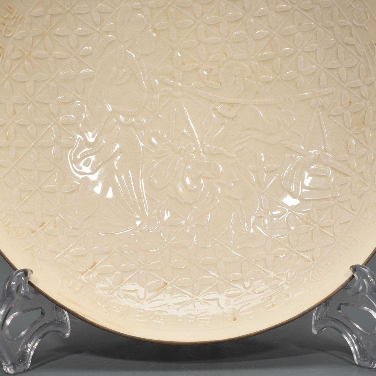 Song Dynasty Ding kiln carved plate with figures of Taoist figures