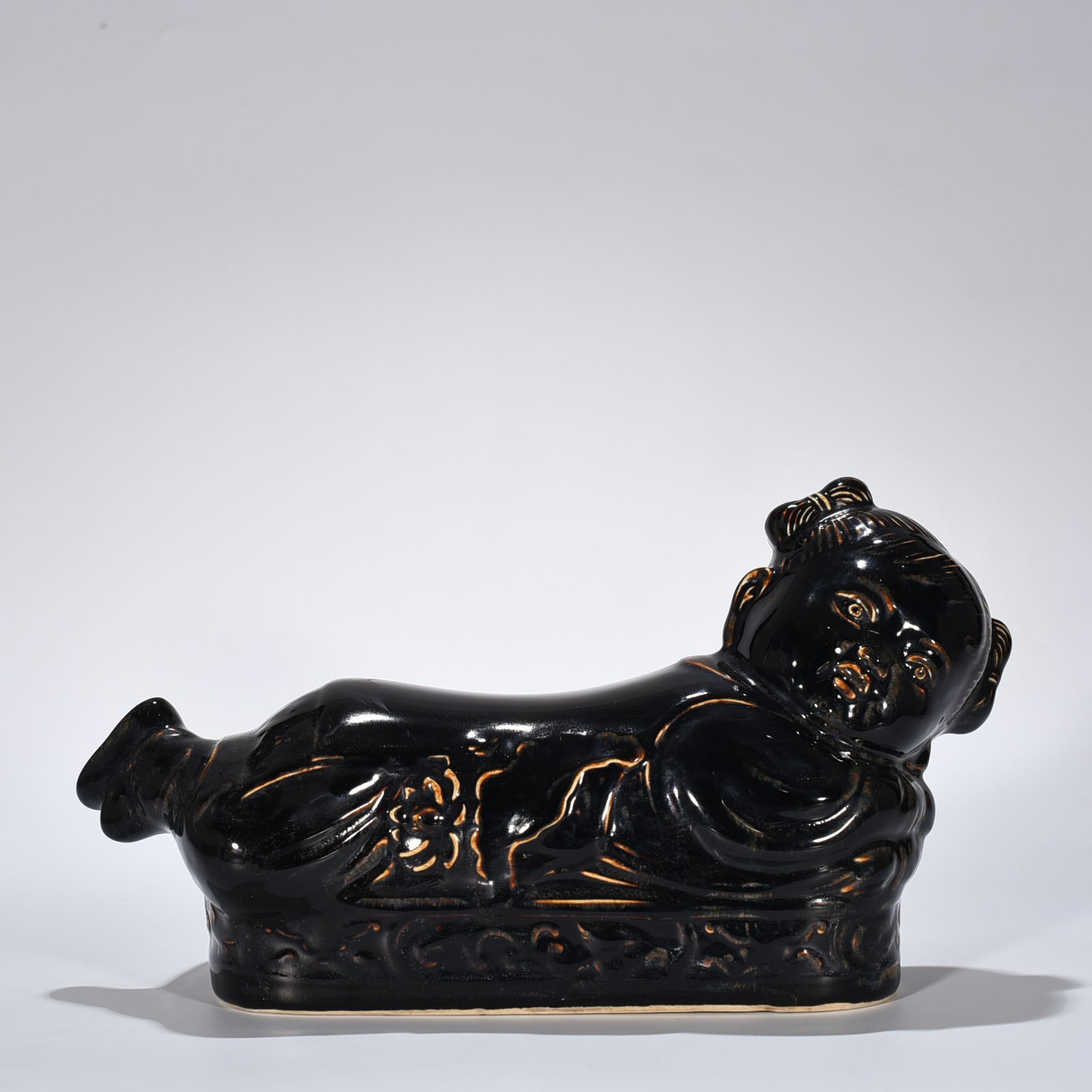 Song Dynasty Ding Kiln three-year black glaze doll pillow
