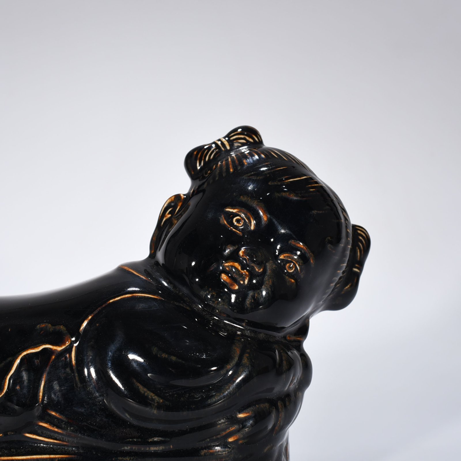 Song Dynasty Ding Kiln three-year black glaze doll pillow