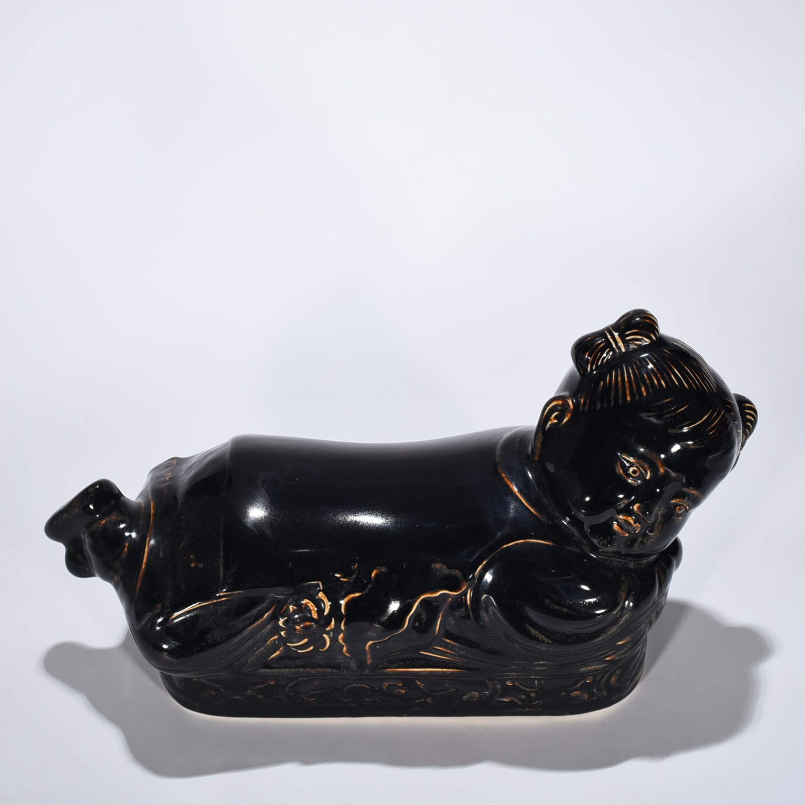 Song Dynasty Ding Kiln three-year black glaze doll pillow