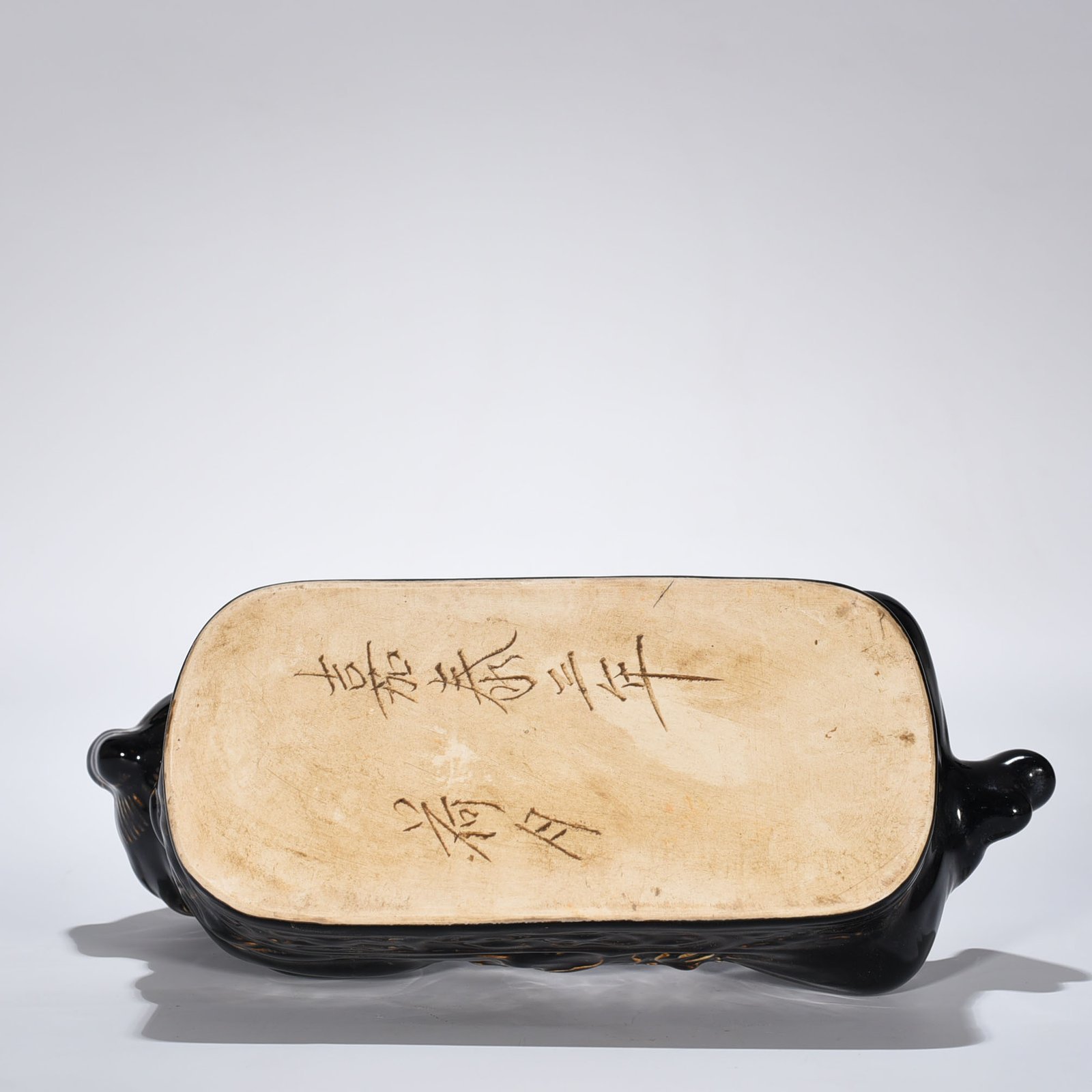 Song Dynasty Ding Kiln three-year black glaze doll pillow