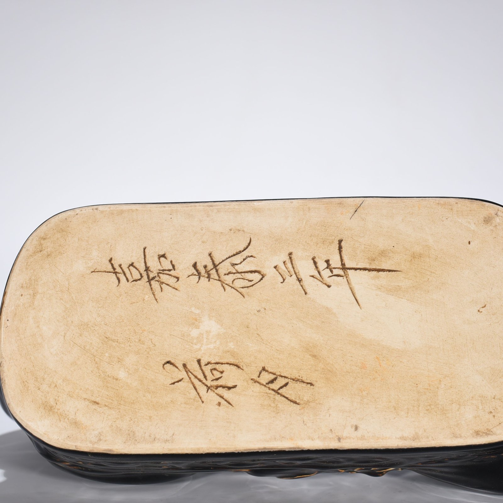 Song Dynasty Ding Kiln three-year black glaze doll pillow
