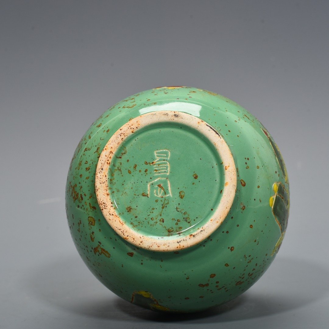 Song Dynasty Ding kiln style green glaze engraved with baby playing pattern and phoenix head pot