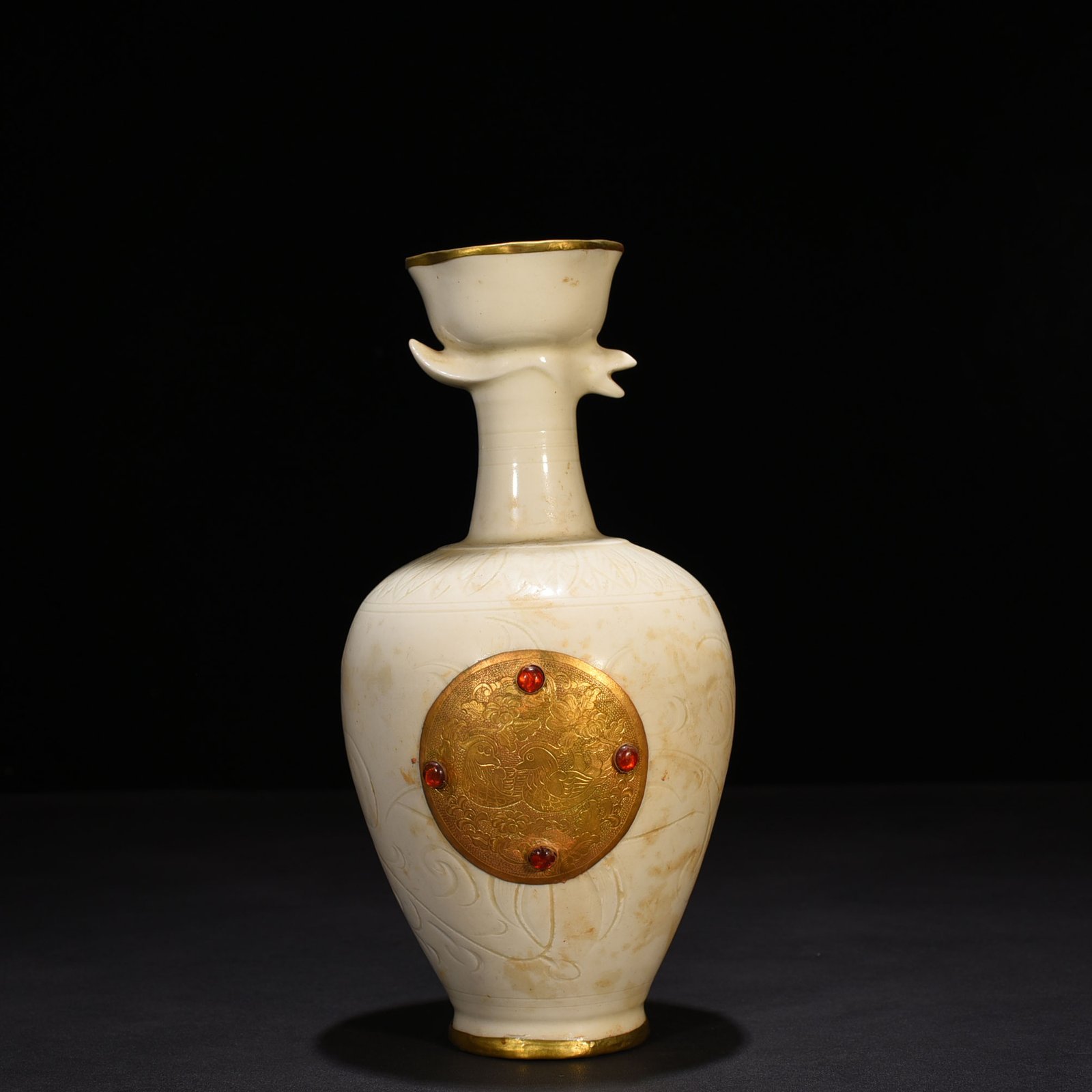 Song Dynasty Ding kiln gold and gem inlaid phoenix head pot