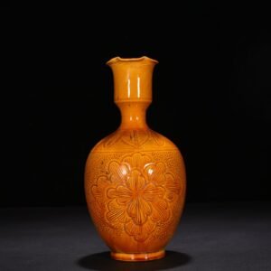 Song Dynasty Ding kiln yellow glaze engraved flower pattern vase