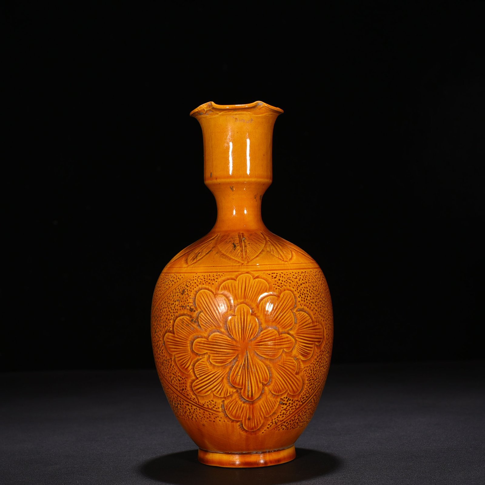 Song Dynasty Ding kiln yellow glaze engraved flower pattern vase
