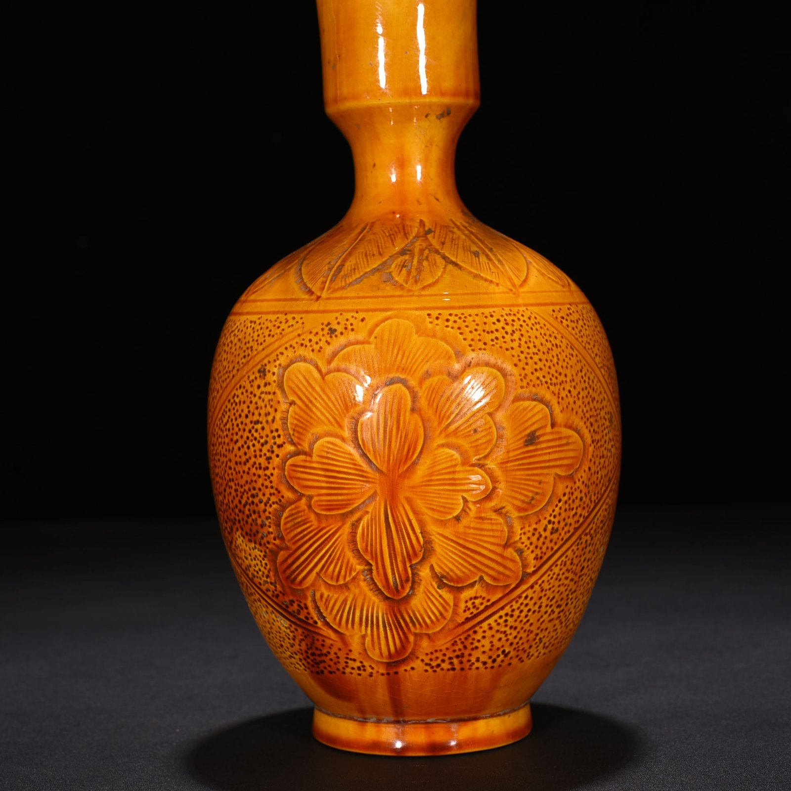 Song Dynasty Ding kiln yellow glaze engraved flower pattern vase