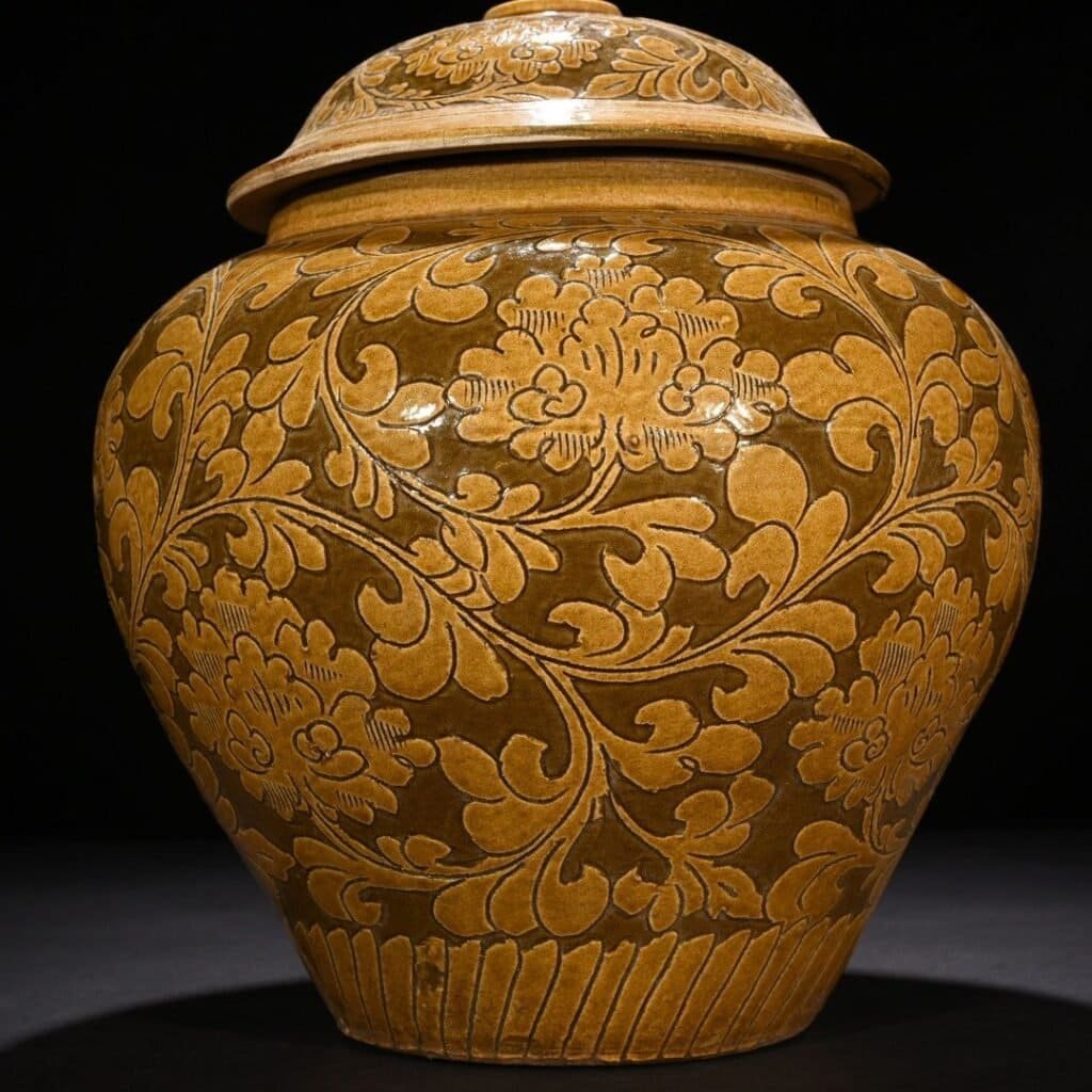 Song Dynasty yellow-glazed Cizhou kiln carved lid jar with entangled branches and floral patterns