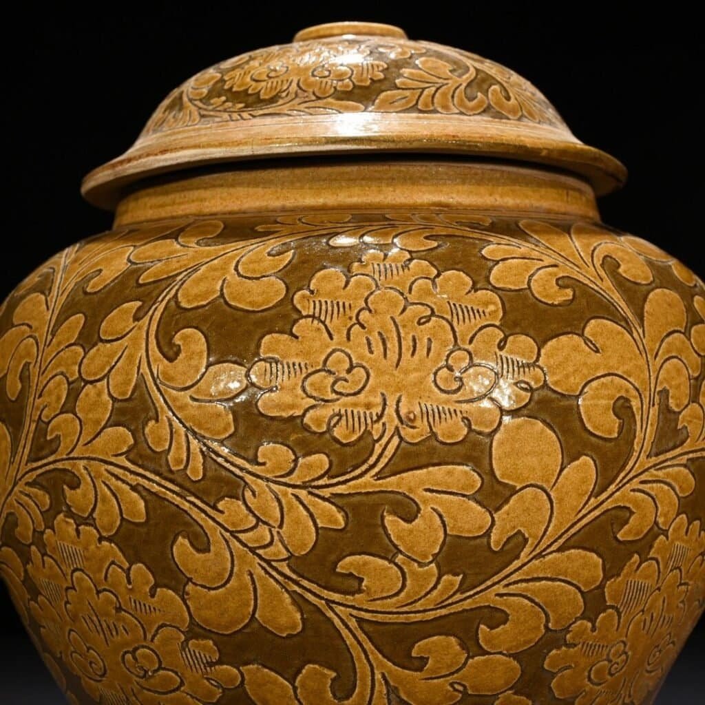 Song Dynasty yellow-glazed Cizhou kiln carved lid jar with entangled branches and floral patterns
