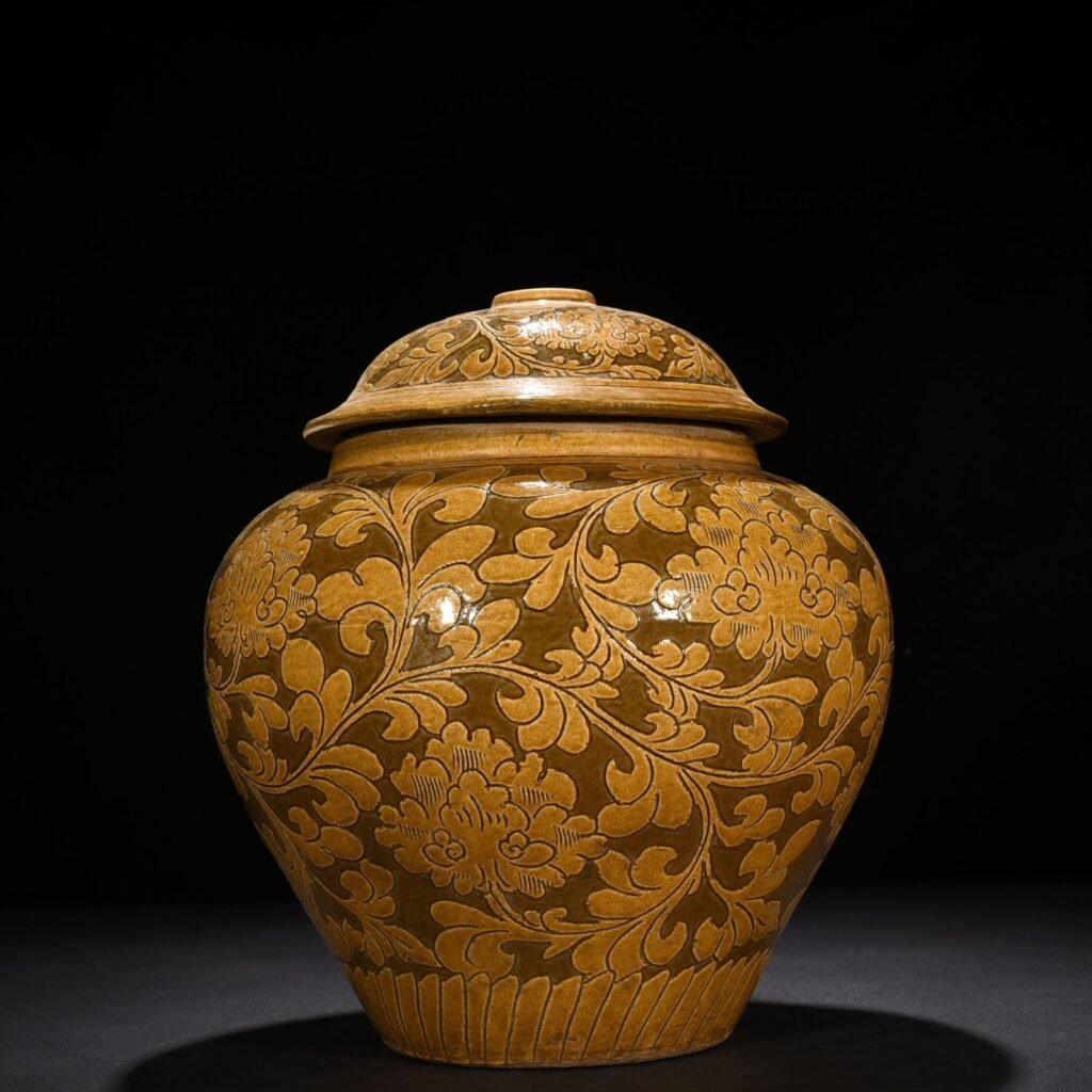 Song Dynasty yellow-glazed Cizhou kiln carved lid jar with entangled branches and floral patterns