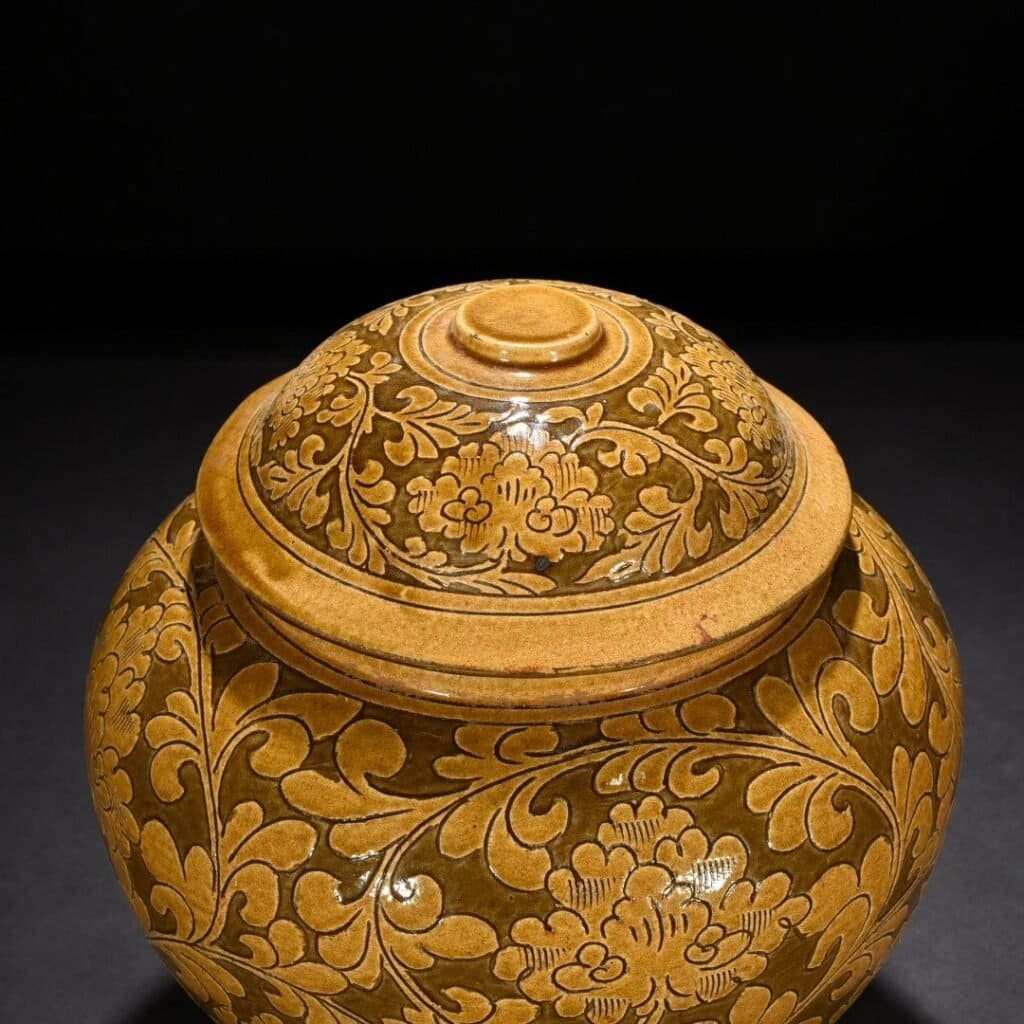 Song Dynasty yellow-glazed Cizhou kiln carved lid jar with entangled branches and floral patterns