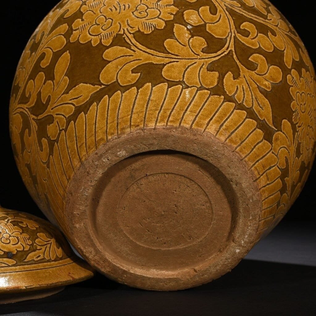 Song Dynasty yellow-glazed Cizhou kiln carved lid jar with entangled branches and floral patterns