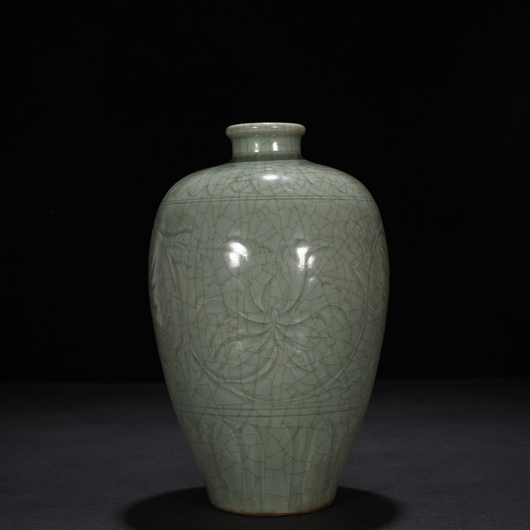 Song Dynasty Longquan kiln carved plum vase with entwining lotus pattern